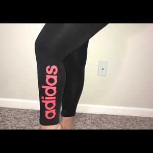 Black adidas leggings with coral brand print